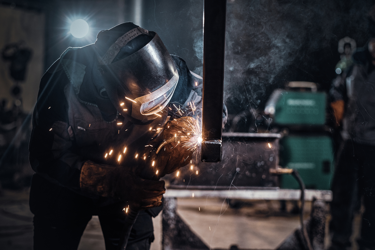 man-is-working-metal-factory-he-is-welding-piece-rail-using-special-tools_2.jpg